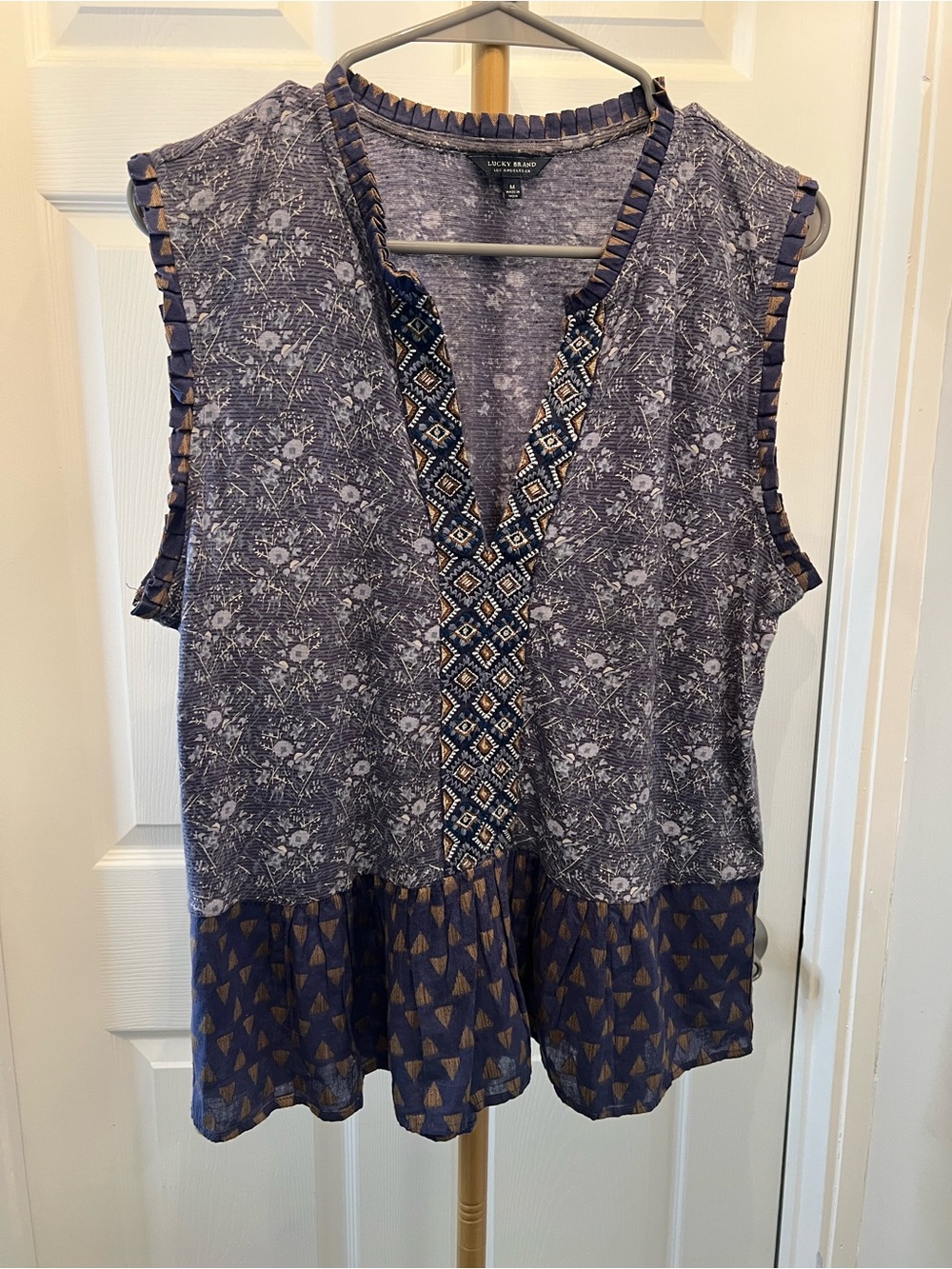 Lucky Brand Navy and Gray Printed Sleeveless Peplum top.